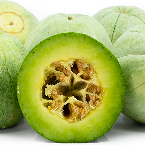Green melon with a cut half showing its interior on a white background