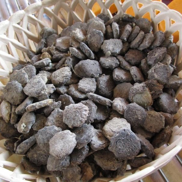 Basket filled with gray stones on a blurred background