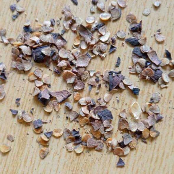 Small stones or pebbles scattered on a wooden surface