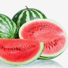 Whole and sliced watermelons on a reflective surface with a white background